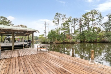 THE VIEW!! Quiet  Peaceful. BOATING!! Covered boat house with 2 on Cypress Country Club and Golf Club  in Alabama - for sale on GolfHomes.com, golf home, golf lot