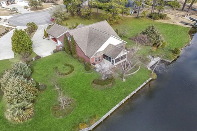 This stunning lakefront home sits perfectly on a peaceful on Wild Wing Plantation in South Carolina - for sale on GolfHomes.com, golf home, golf lot
