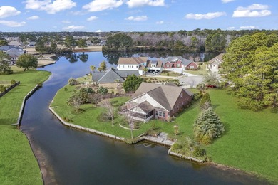 This stunning lakefront home sits perfectly on a peaceful on Wild Wing Plantation in South Carolina - for sale on GolfHomes.com, golf home, golf lot