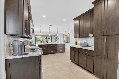 Experience refined country club living in this beautifully on Hunters Run Golf and Country Club in Florida - for sale on GolfHomes.com, golf home, golf lot
