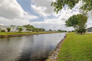 Enjoy peaceful water views and your own Mango Tree from this on Savanna Golf Club in Florida - for sale on GolfHomes.com, golf home, golf lot