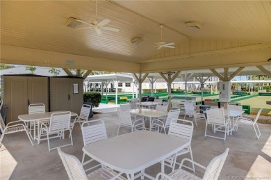 Enjoy peaceful water views and your own Mango Tree from this on Savanna Golf Club in Florida - for sale on GolfHomes.com, golf home, golf lot