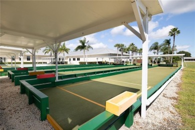 Enjoy peaceful water views and your own Mango Tree from this on Savanna Golf Club in Florida - for sale on GolfHomes.com, golf home, golf lot