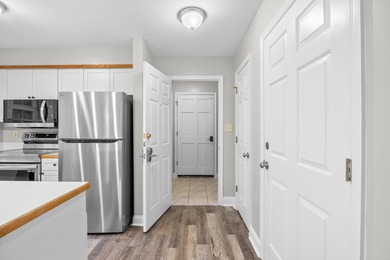 Located within Weehawka Woods in Pawleys Plantation, this condo on Pawleys Plantation Golf and Country Club in South Carolina - for sale on GolfHomes.com, golf home, golf lot