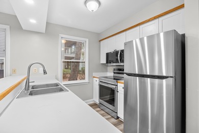 Located within Weehawka Woods in Pawleys Plantation, this condo on Pawleys Plantation Golf and Country Club in South Carolina - for sale on GolfHomes.com, golf home, golf lot