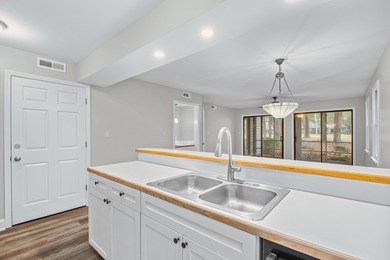 Located within Weehawka Woods in Pawleys Plantation, this condo on Pawleys Plantation Golf and Country Club in South Carolina - for sale on GolfHomes.com, golf home, golf lot