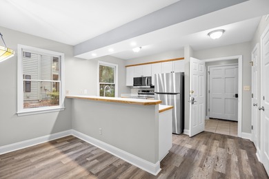 Located within Weehawka Woods in Pawleys Plantation, this condo on Pawleys Plantation Golf and Country Club in South Carolina - for sale on GolfHomes.com, golf home, golf lot