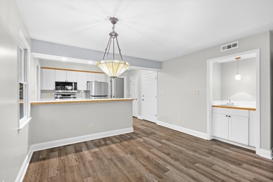 Located within Weehawka Woods in Pawleys Plantation, this condo on Pawleys Plantation Golf and Country Club in South Carolina - for sale on GolfHomes.com, golf home, golf lot