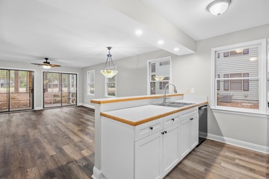 Located within Weehawka Woods in Pawleys Plantation, this condo on Pawleys Plantation Golf and Country Club in South Carolina - for sale on GolfHomes.com, golf home, golf lot