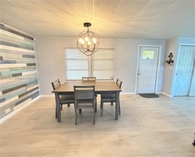 This stunning double-wide modern mobile home is located in a 55+ on Davie Golf Club in Florida - for sale on GolfHomes.com, golf home, golf lot