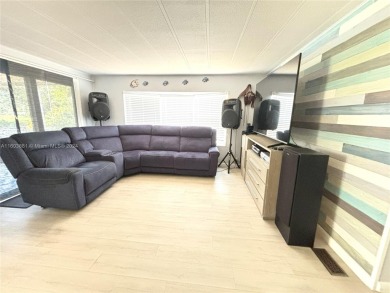 This stunning double-wide modern mobile home is located in a 55+ on Davie Golf Club in Florida - for sale on GolfHomes.com, golf home, golf lot