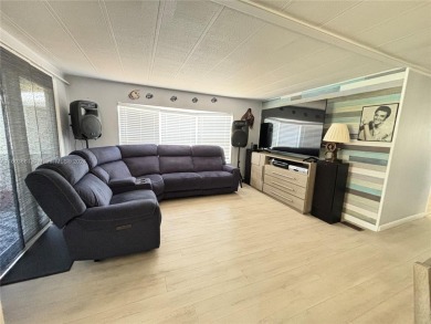 This stunning double-wide modern mobile home is located in a 55+ on Davie Golf Club in Florida - for sale on GolfHomes.com, golf home, golf lot