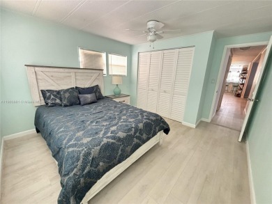 This stunning double-wide modern mobile home is located in a 55+ on Davie Golf Club in Florida - for sale on GolfHomes.com, golf home, golf lot