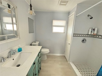 This stunning double-wide modern mobile home is located in a 55+ on Davie Golf Club in Florida - for sale on GolfHomes.com, golf home, golf lot