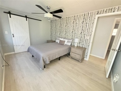 This stunning double-wide modern mobile home is located in a 55+ on Davie Golf Club in Florida - for sale on GolfHomes.com, golf home, golf lot