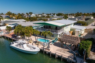 Well maintained Full Duplex with a 75ft. concrete dock w/ davits on Key Colony Beach Golf Course in Florida - for sale on GolfHomes.com, golf home, golf lot