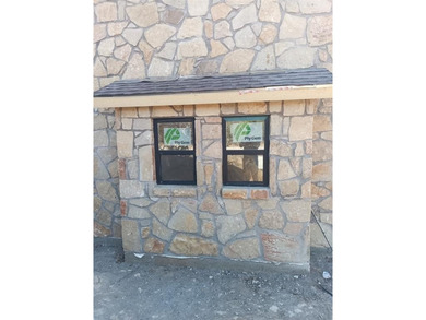 This rustic single story home at 105 Harbour Town Dr is located on The Cliffs Resort in Texas - for sale on GolfHomes.com, golf home, golf lot