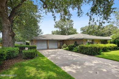 Charming 3-bedroom 2-bathroom home nestled on a beautifully on Diamondhead Country Club in Mississippi - for sale on GolfHomes.com, golf home, golf lot