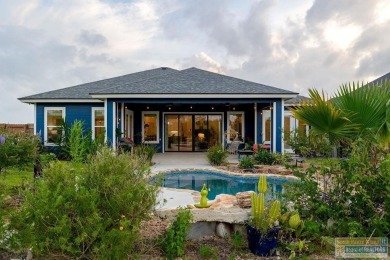 This stunning 3BR/2BA home offers a 2-car garage + a golf cart on South Padre Island Golf Club in Texas - for sale on GolfHomes.com, golf home, golf lot