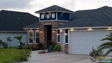 This stunning 3BR/2BA home offers a 2-car garage + a golf cart on South Padre Island Golf Club in Texas - for sale on GolfHomes.com, golf home, golf lot