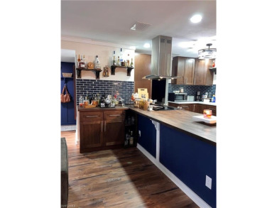 Welcome to your dream home at 6765 Overlook Drive, nestled in on Cypress Lake Country Club in Florida - for sale on GolfHomes.com, golf home, golf lot