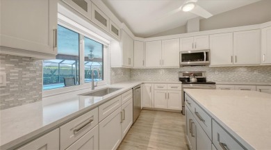 Tucked away among mature trees and lush landscaping, this on IMG Academies Golf and Country Club in Florida - for sale on GolfHomes.com, golf home, golf lot