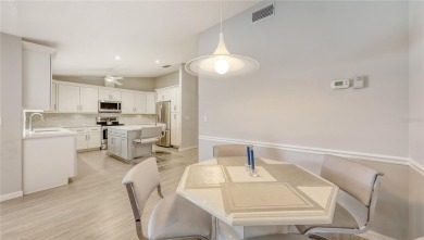 Tucked away among mature trees and lush landscaping, this on IMG Academies Golf and Country Club in Florida - for sale on GolfHomes.com, golf home, golf lot