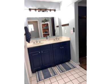 Welcome to your dream home at 6765 Overlook Drive, nestled in on Cypress Lake Country Club in Florida - for sale on GolfHomes.com, golf home, golf lot
