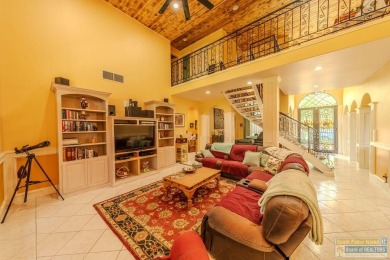 Tucked along the fairway in Rancho Escondido, this 4,037 sq ft on Rancho Viejo Resort and Country Club in Texas - for sale on GolfHomes.com, golf home, golf lot