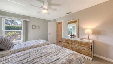 Tucked away among mature trees and lush landscaping, this on IMG Academies Golf and Country Club in Florida - for sale on GolfHomes.com, golf home, golf lot