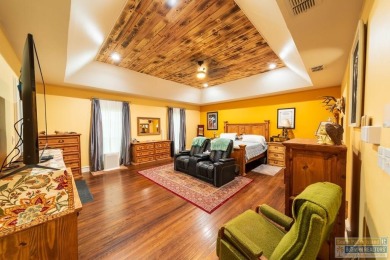 Tucked along the fairway in Rancho Escondido, this 4,037 sq ft on Rancho Viejo Resort and Country Club in Texas - for sale on GolfHomes.com, golf home, golf lot