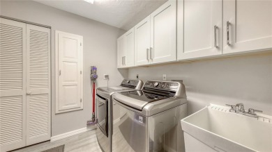 Tucked away among mature trees and lush landscaping, this on IMG Academies Golf and Country Club in Florida - for sale on GolfHomes.com, golf home, golf lot