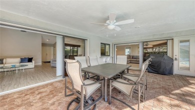 Tucked away among mature trees and lush landscaping, this on IMG Academies Golf and Country Club in Florida - for sale on GolfHomes.com, golf home, golf lot