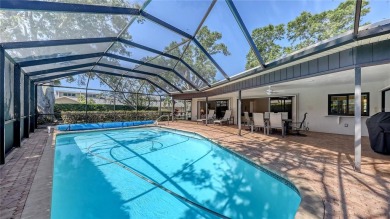 Tucked away among mature trees and lush landscaping, this on IMG Academies Golf and Country Club in Florida - for sale on GolfHomes.com, golf home, golf lot