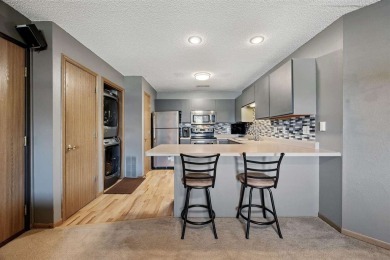 Enjoy top-floor privacy and peaceful views from this pristine on Quail Creek Golf Course in Iowa - for sale on GolfHomes.com, golf home, golf lot