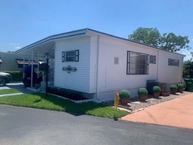 This 1200 square feet, 1.0 bed 1.5 bath Manufactured Home in the on Orangebrook Golf and Country Club in Florida - for sale on GolfHomes.com, golf home, golf lot