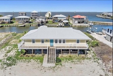 WATERFRONT ISLAND DREAM IN AN AMAZING LOCATION! Home has approx on Isle Dauphine Club Golf Course in Alabama - for sale on GolfHomes.com, golf home, golf lot