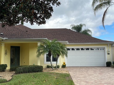 Move-in ready and beautifully furnished! No Bond! This one-owner on Arlington Ridge Golf Club in Florida - for sale on GolfHomes.com, golf home, golf lot