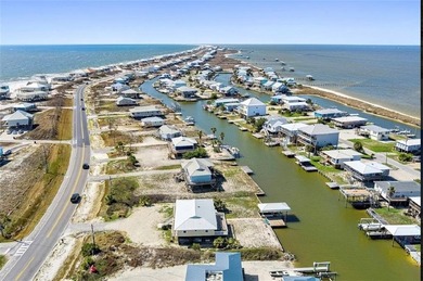 WATERFRONT ISLAND DREAM IN AN AMAZING LOCATION! Home has approx on Isle Dauphine Club Golf Course in Alabama - for sale on GolfHomes.com, golf home, golf lot