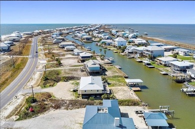 WATERFRONT ISLAND DREAM IN AN AMAZING LOCATION! Home has approx on Isle Dauphine Club Golf Course in Alabama - for sale on GolfHomes.com, golf home, golf lot