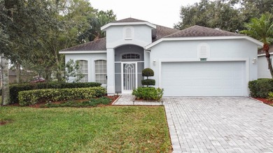 Home is a  St Andrews model located on a corner lot. A paver on Kings Ridge Golf Club in Florida - for sale on GolfHomes.com, golf home, golf lot