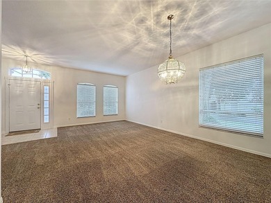 Home is a  St Andrews model located on a corner lot. A paver on Kings Ridge Golf Club in Florida - for sale on GolfHomes.com, golf home, golf lot