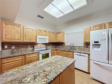 Home is a  St Andrews model located on a corner lot. A paver on Kings Ridge Golf Club in Florida - for sale on GolfHomes.com, golf home, golf lot