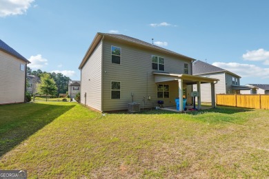 The spacious home features 5 bedrooms, 3 full baths, and a 2-car on Canongate At Heron Bay in Georgia - for sale on GolfHomes.com, golf home, golf lot