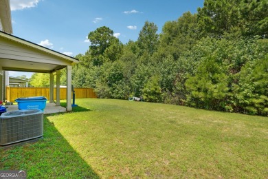 The spacious home features 5 bedrooms, 3 full baths, and a 2-car on Canongate At Heron Bay in Georgia - for sale on GolfHomes.com, golf home, golf lot