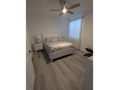 GROUND FLOOR, END UNIT, 3-bedroom, 2 bathroom condominium with on Lakewood National Golf Club in Florida - for sale on GolfHomes.com, golf home, golf lot