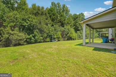 The spacious home features 5 bedrooms, 3 full baths, and a 2-car on Canongate At Heron Bay in Georgia - for sale on GolfHomes.com, golf home, golf lot