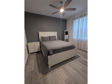 GROUND FLOOR, END UNIT, 3-bedroom, 2 bathroom condominium with on Lakewood National Golf Club in Florida - for sale on GolfHomes.com, golf home, golf lot