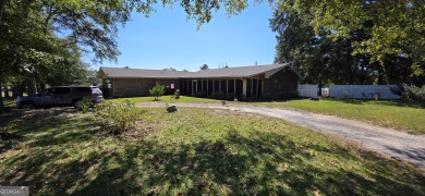 Welcome to 51 Play Golf Drive - a rare retreat just outside the on The International City Golf Course in Georgia - for sale on GolfHomes.com, golf home, golf lot