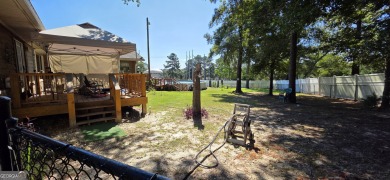 Welcome to 51 Play Golf Drive - a rare retreat just outside the on The International City Golf Course in Georgia - for sale on GolfHomes.com, golf home, golf lot